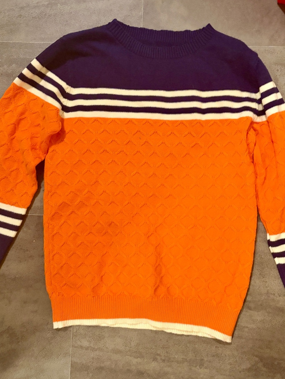 Amazon Orange Cable-Knit Sweater with Purple Yoke and White Stripes